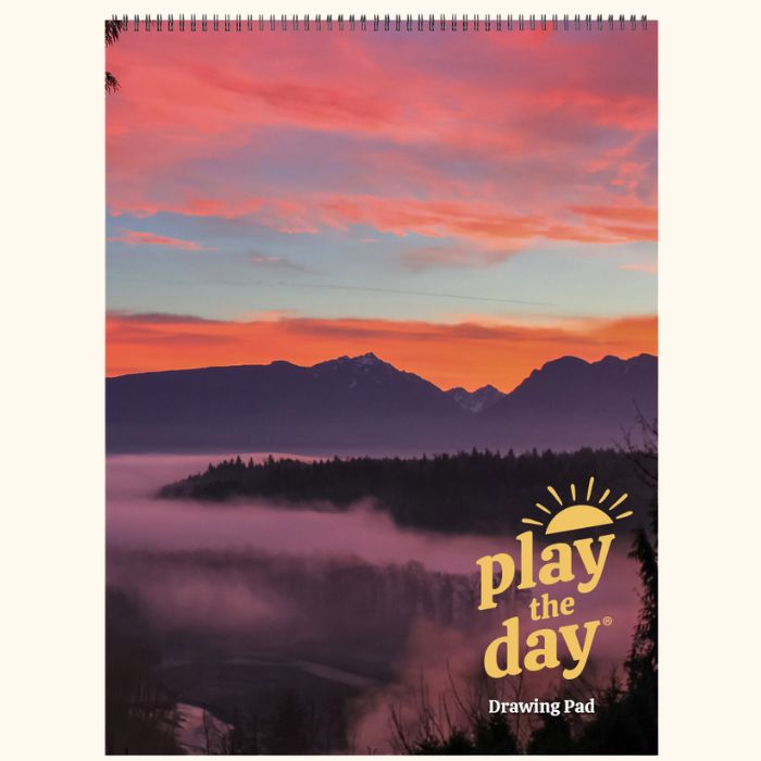 9 x 12 Play the Day® art pad cover with a vivid winter sunrise over the Skykomish Valley and low morning fog