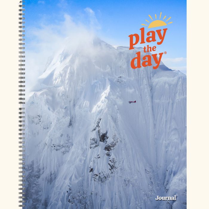 8.5 x 11 Play the Day® recycled paper journal cover showing a scenic flight near Denali in the Alaska Range