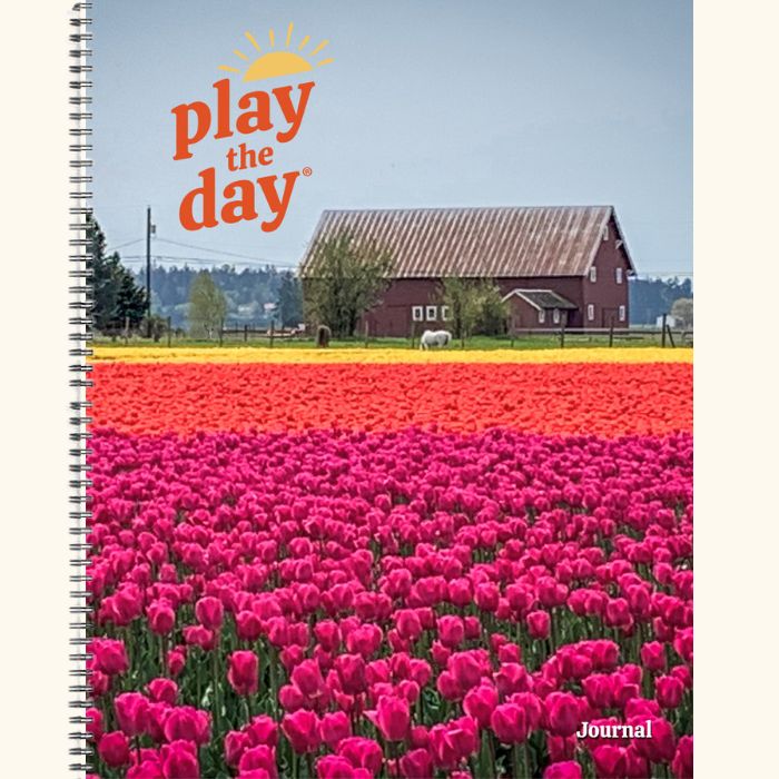 8.5 x 11 Play the Day® recycled paper journal cover featuring tulip fields and a red barn in Skagit Valley