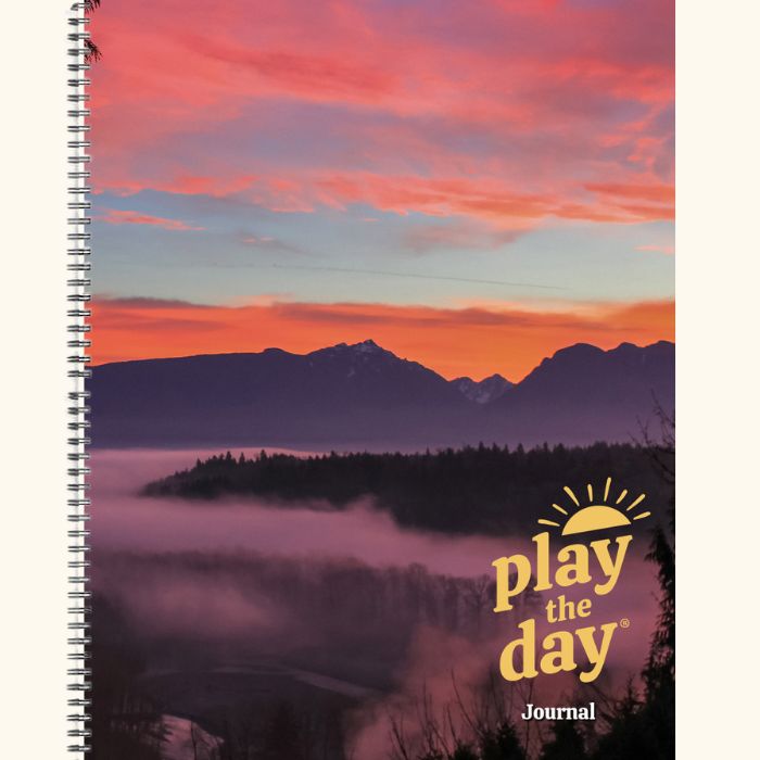 8.5 x 11 Play the Day® recycled paper journal cover with a colorful sunrise over the Skykomish Valley and morning fog