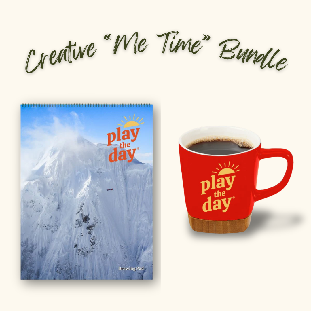 Play the Day® Creative “Me Time” Bundle with Alaska Range Scenic Flight recycled paper art pad and red mug with bamboo coaster.