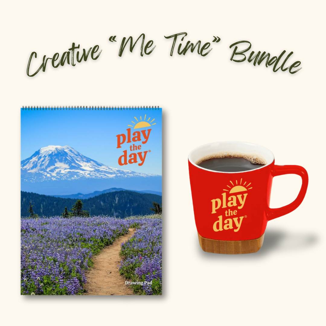 Play the Day® Creative “Me Time” Bundle with Mt. Adams and Lupine on the PCT recycled paper art pad and red mug with bamboo coaster.