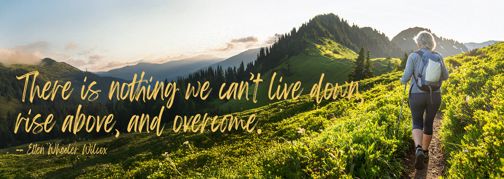 Back view of a hiker trekking through a mountain meadow with the Ellen Wheeler Wilcox quote overlayed.