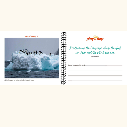 52-week perpetual calendar pages with penguins on an iceberg and a quote by Mark Twain, featuring the brand 'play.theday'.