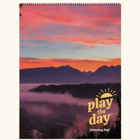 9 x 12 Play the Day® art pad cover with a vivid winter sunrise over the Skykomish Valley and low morning fog