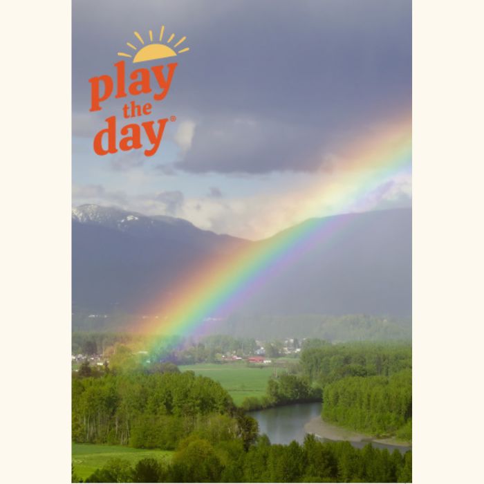 Play the Day® notecard featuring a rainbow over the Skykomish River valley and green fields