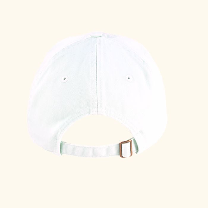 Back view of white Play the Day® cap with adjustable metal strap and organic cotton twill fabric