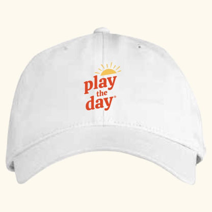 White Play the Day® organic cotton twill cap with front embroidery and curved brim
