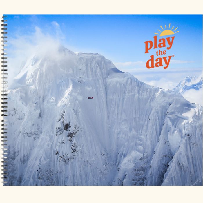 Play the Day® journal cover with snow-covered Alaska Range and small plane near Denali