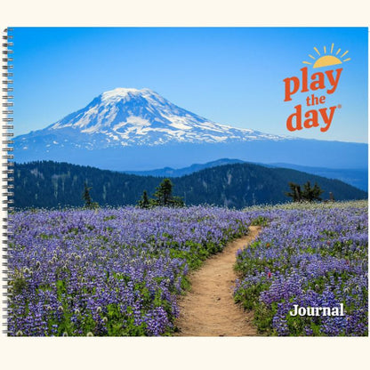 Play the Day® journal cover featuring a wildflower trail leading to a snow-covered mountain