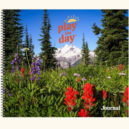 Play the Day® journal cover with alpine wildflowers and pine trees beneath a mountain peak