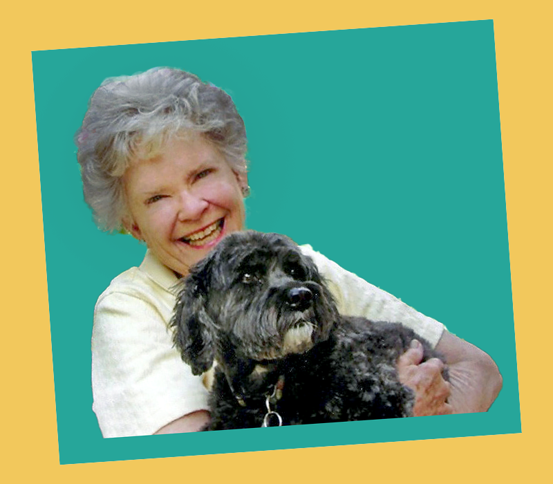 Sydney Dickinson smiling while holding Lucy the dog, against a teal background framed in yellow.